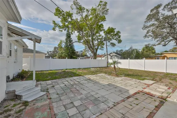 an aerial view of a house with big yard