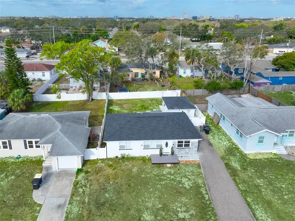 an aerial view of residential houses with outdoor space