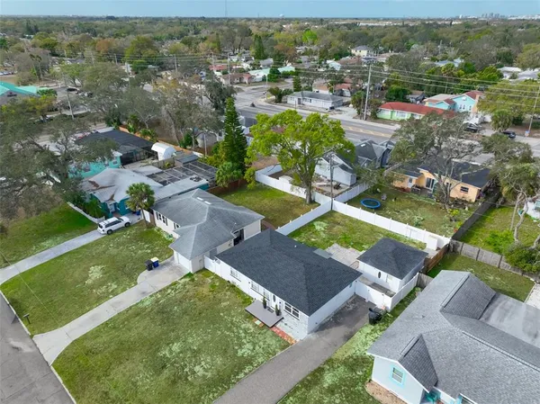 an aerial view of residential houses with outdoor space