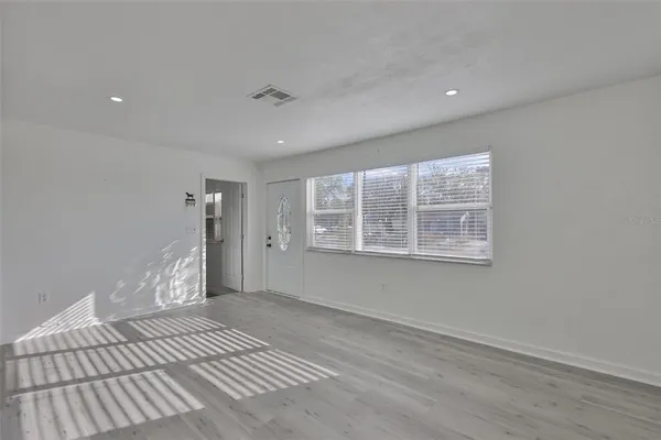 a view of an empty room with a window