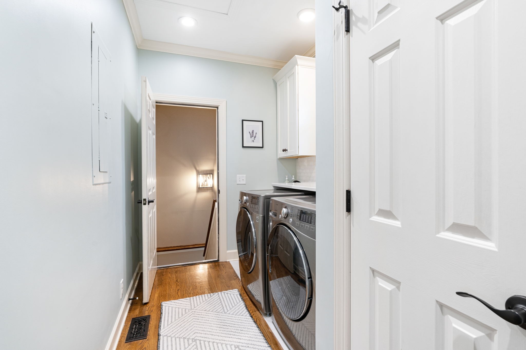 910 Riverbend Road Nashville, TN 37221 - Photo 13 of 48 a view of a hallway with washer and dryer