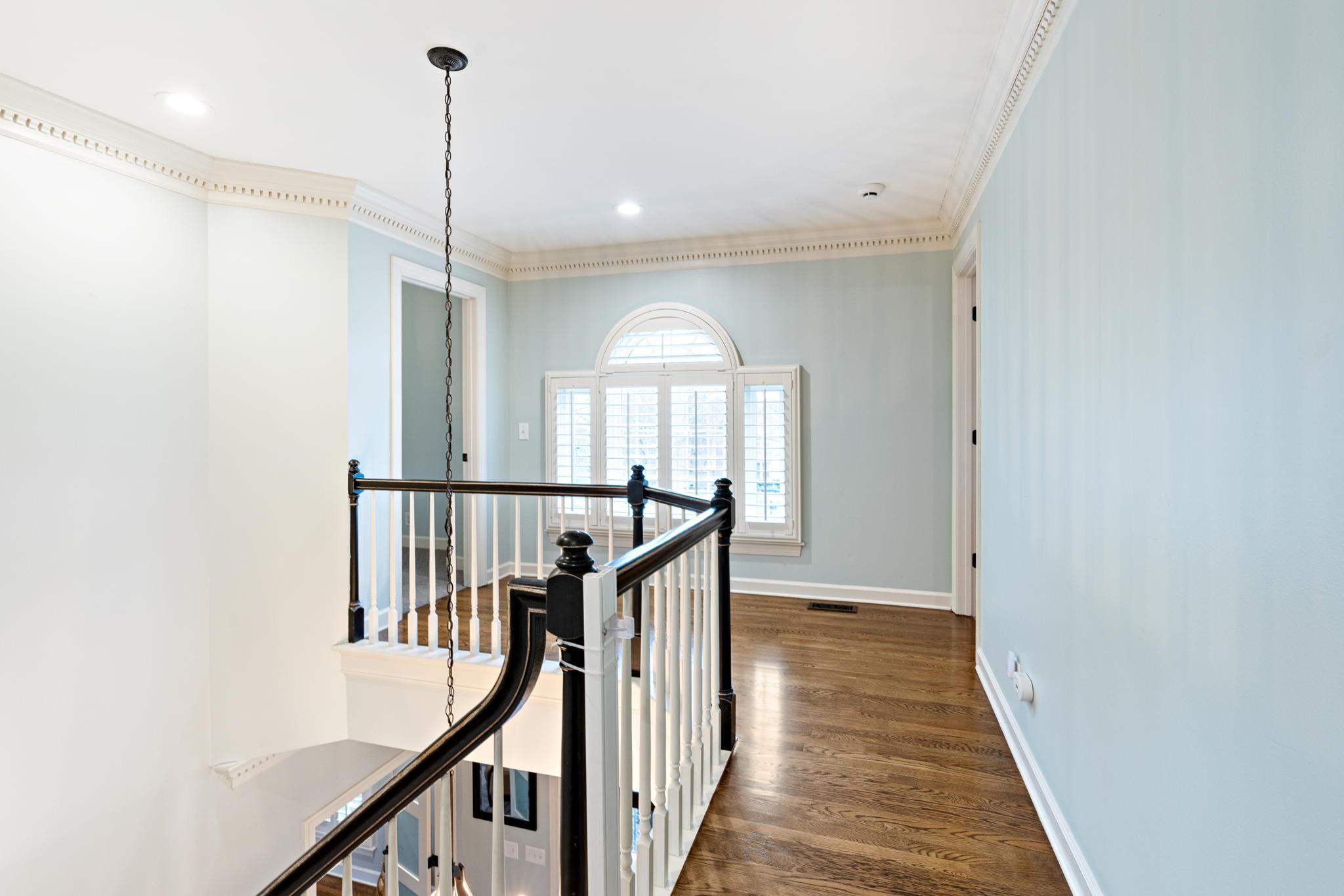 910 Riverbend Road Nashville, TN 37221 - Photo 20 of 48 a view of a hallway with wooden floor and staircase
