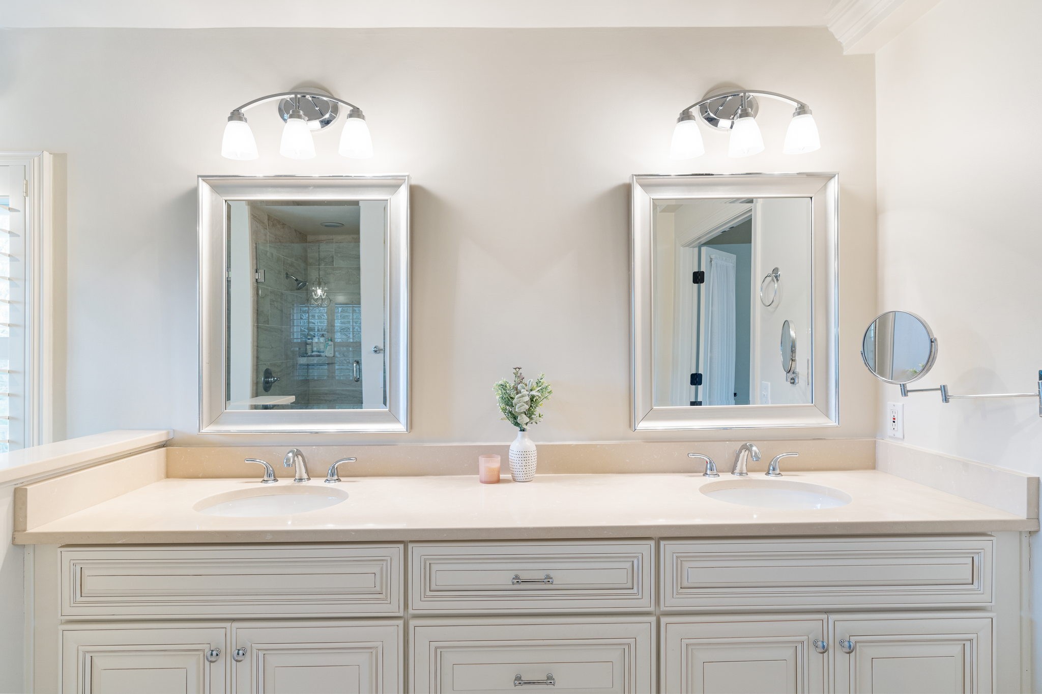 910 Riverbend Road Nashville, TN 37221 - Photo 23 of 48 a bathroom with double vanity sinks and a mirror