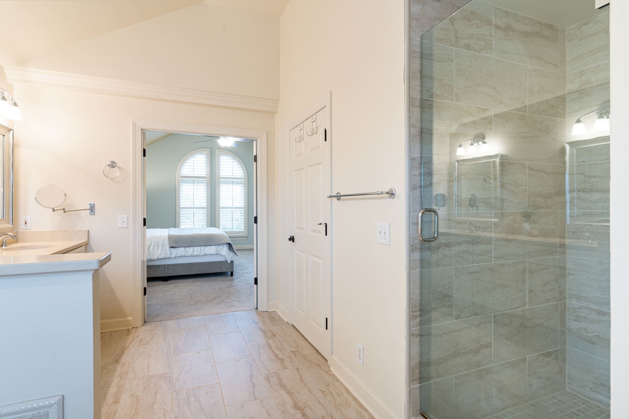 910 Riverbend Road Nashville, TN 37221 - Photo 25 of 48 a en suite bathroom with a sink a mirror and a shower