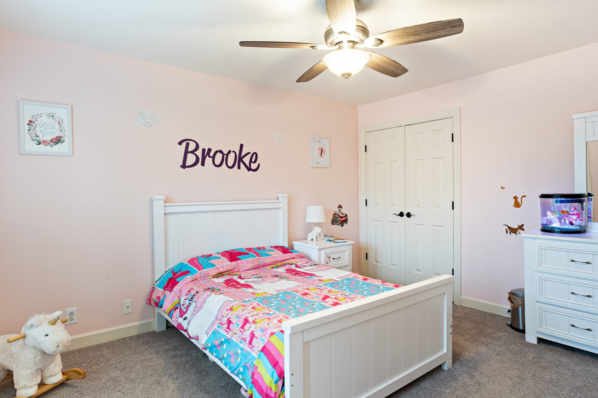 910 Riverbend Road Nashville, TN 37221 - Photo 27 of 48 a bedroom with a bed and a chandelier