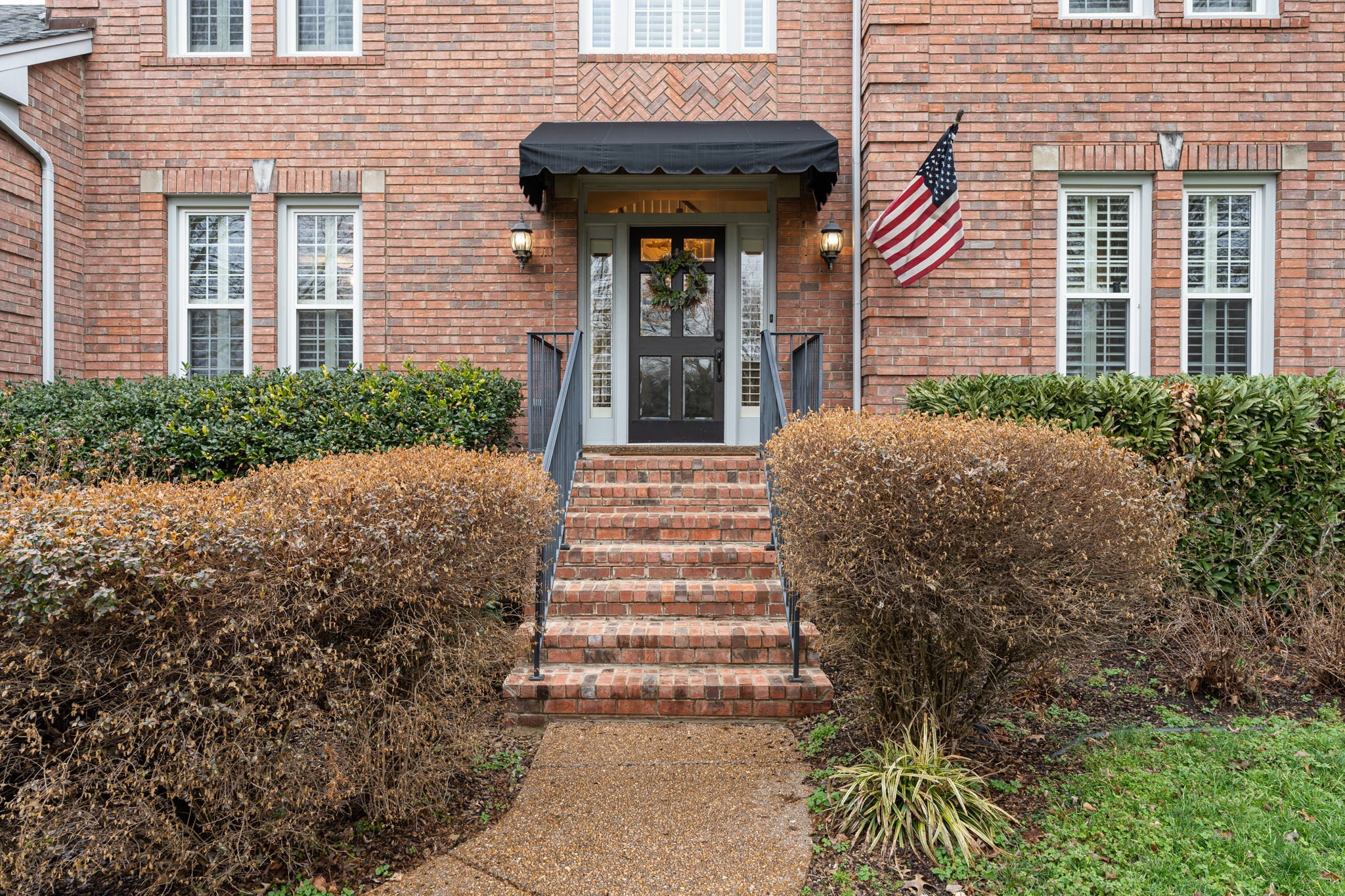 910 Riverbend Road Nashville, TN 37221 - Photo 3 of 48 a front view of a house with glass windows