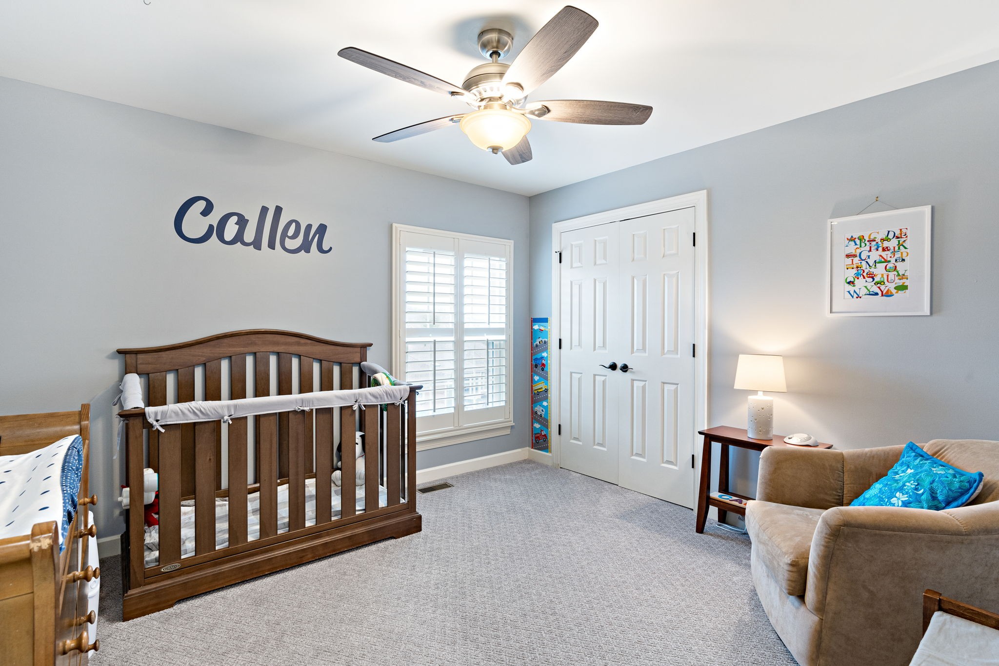 910 Riverbend Road Nashville, TN 37221 - Photo 31 of 48 a bedroom with furniture and a chandelier