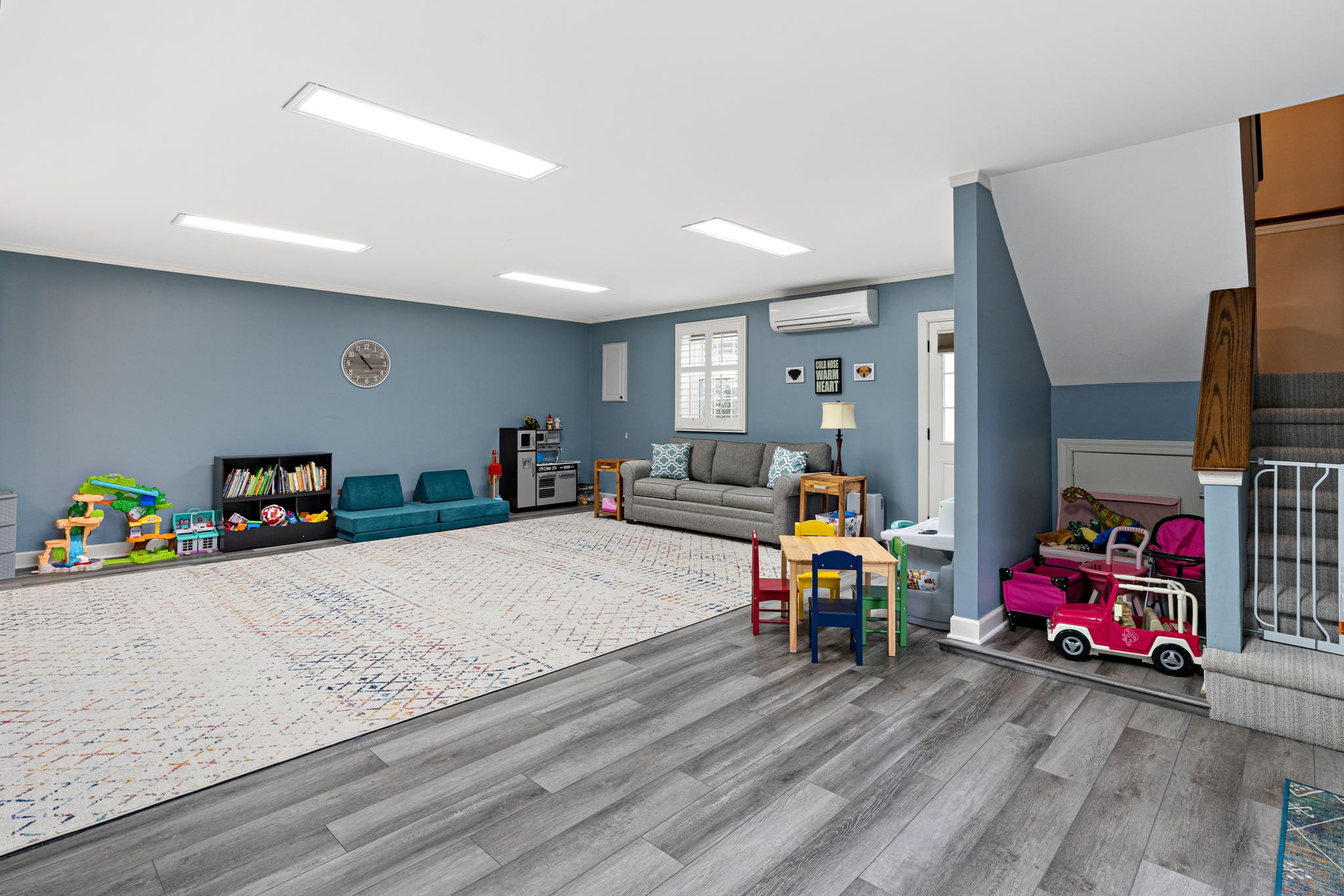 910 Riverbend Road Nashville, TN 37221 - Photo 34 of 48 a bedroom with furniture and a wooden floor