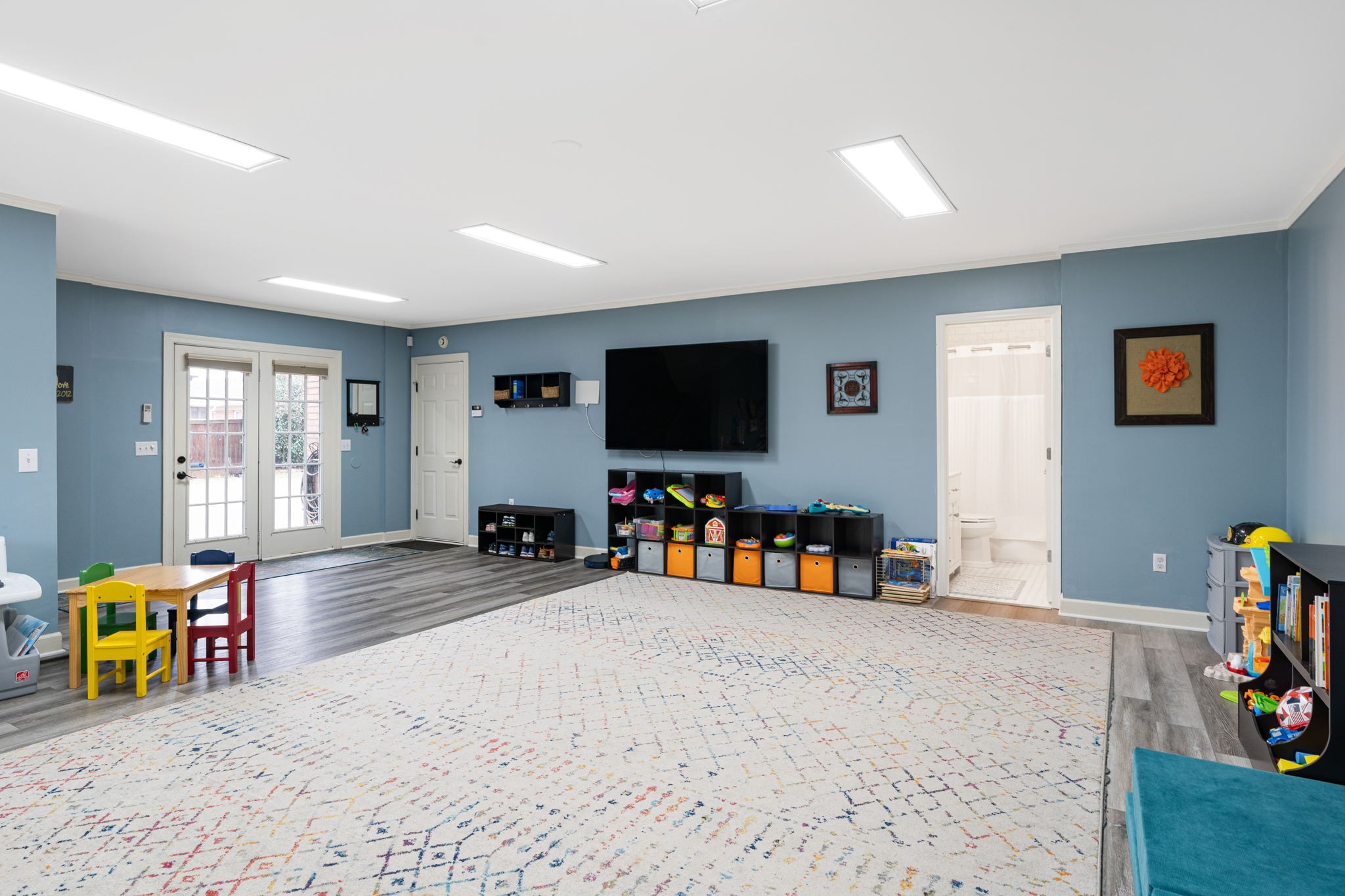 910 Riverbend Road Nashville, TN 37221 - Photo 35 of 48 a view of a livingroom with furniture and a flat screen tv