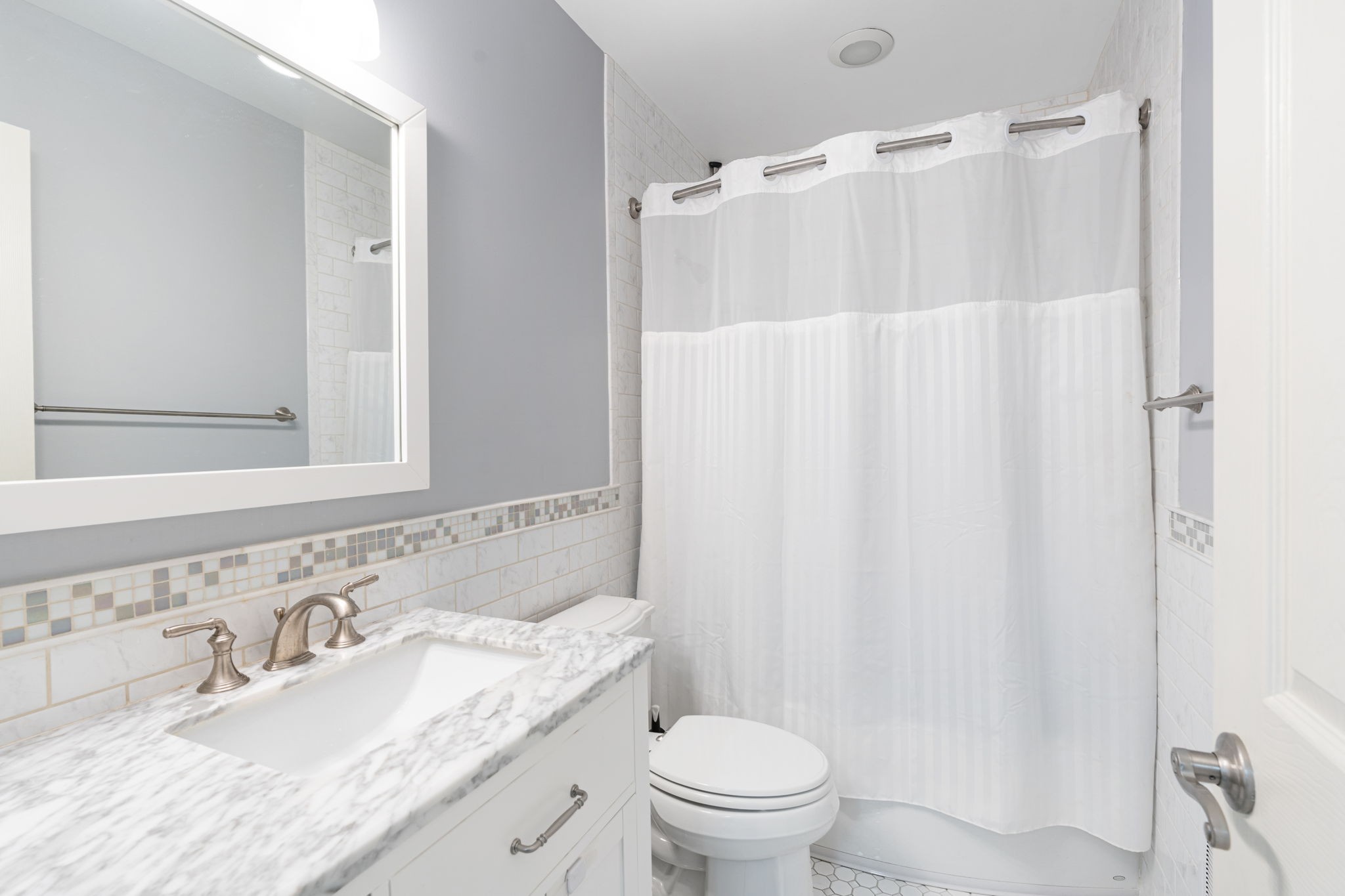 910 Riverbend Road Nashville, TN 37221 - Photo 36 of 48 a bathroom with a granite countertop sink toilet and shower
