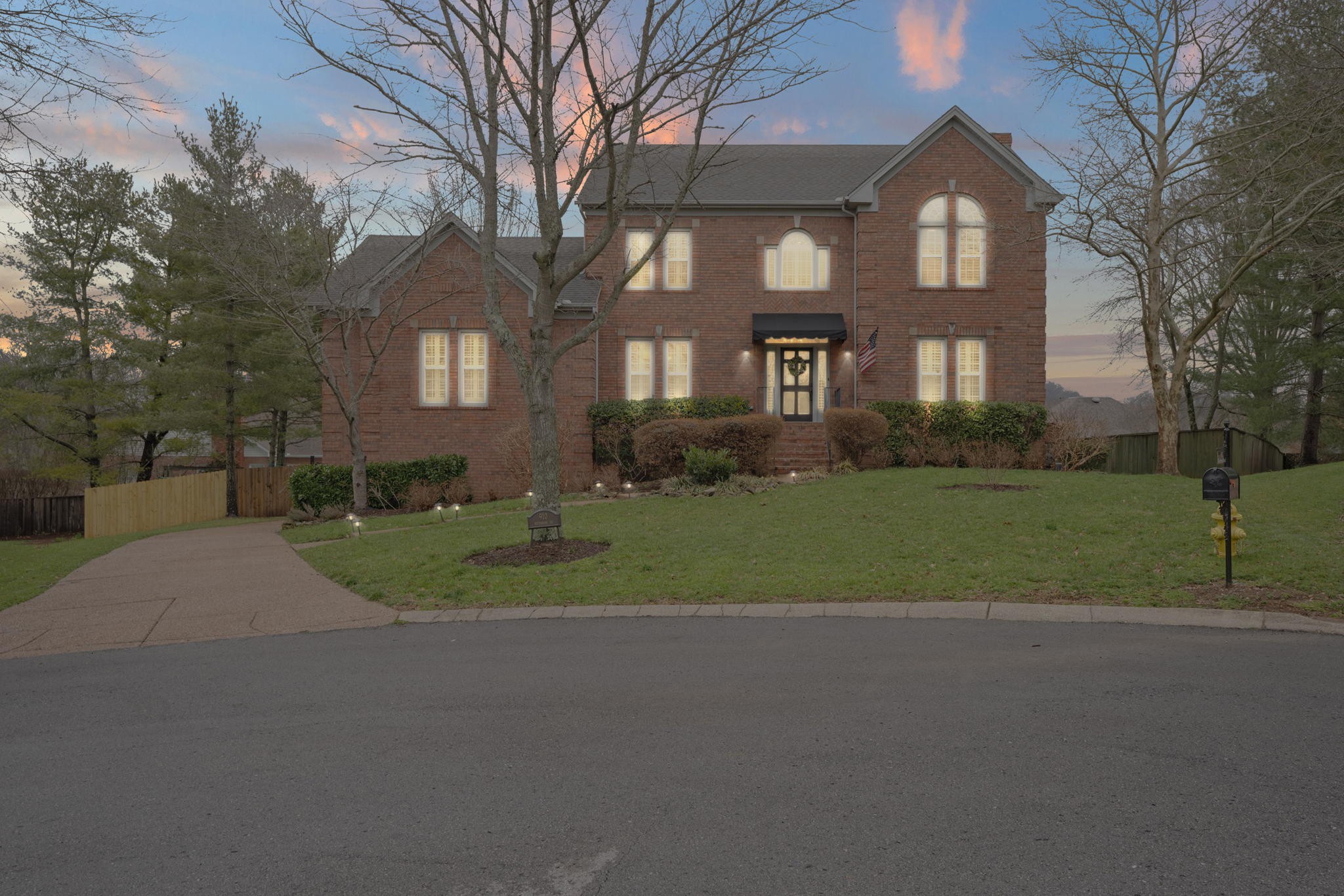 910 Riverbend Road Nashville, TN 37221 - Photo 48 of 48 a front view of a house with a yard and garage