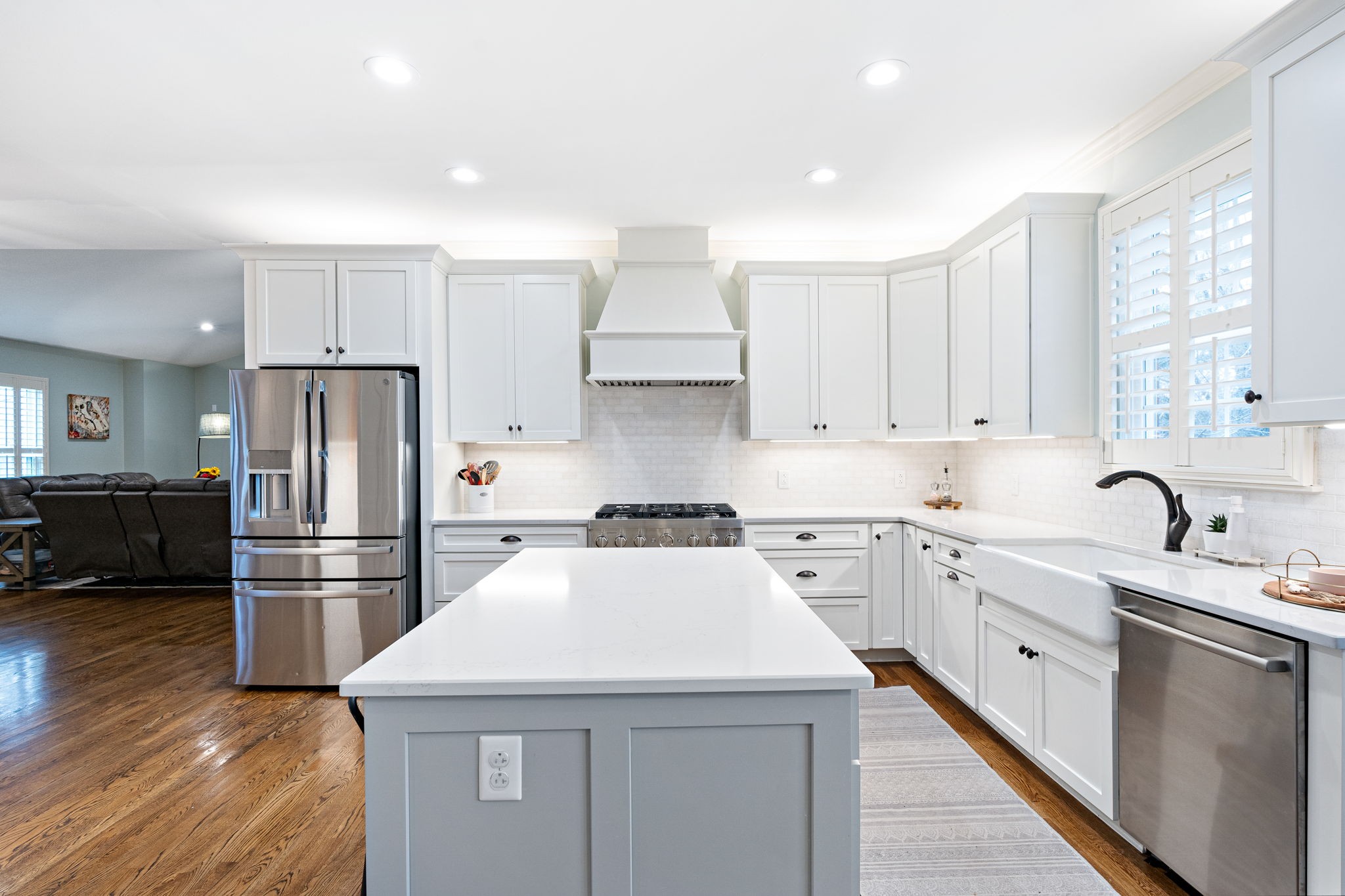 910 Riverbend Road Nashville, TN 37221 - Photo 6 of 48 a kitchen with a sink a stove a refrigerator and white cabinets