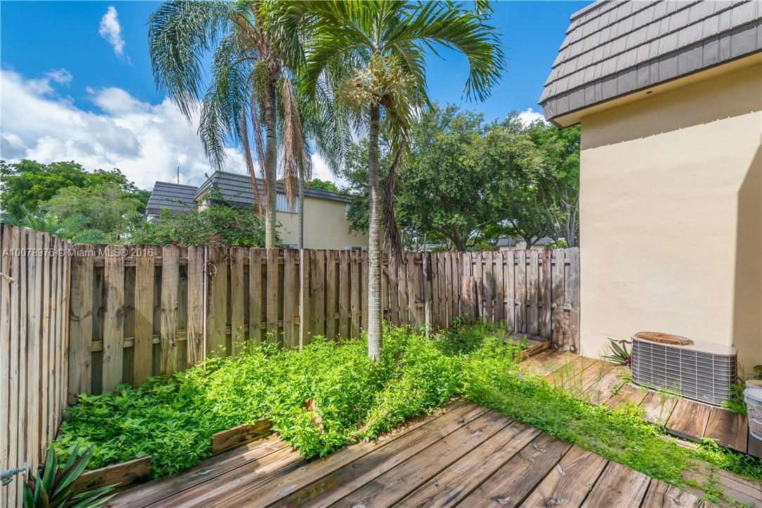 8375 Southwest 137th Avenue, Unit 8375 Miami, FL 33183 - Photo 12 of 30 a view of a backyard with plants