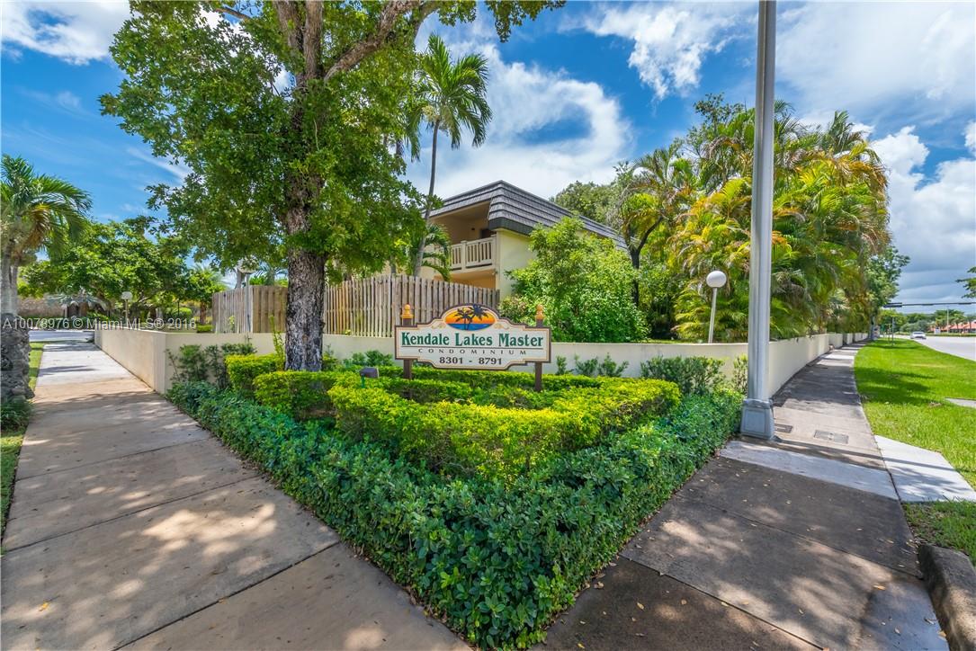 8375 Southwest 137th Avenue, Unit 8375 Miami, FL 33183 - Photo 15 of 30 a front view of a house with a yard and fountain in middle