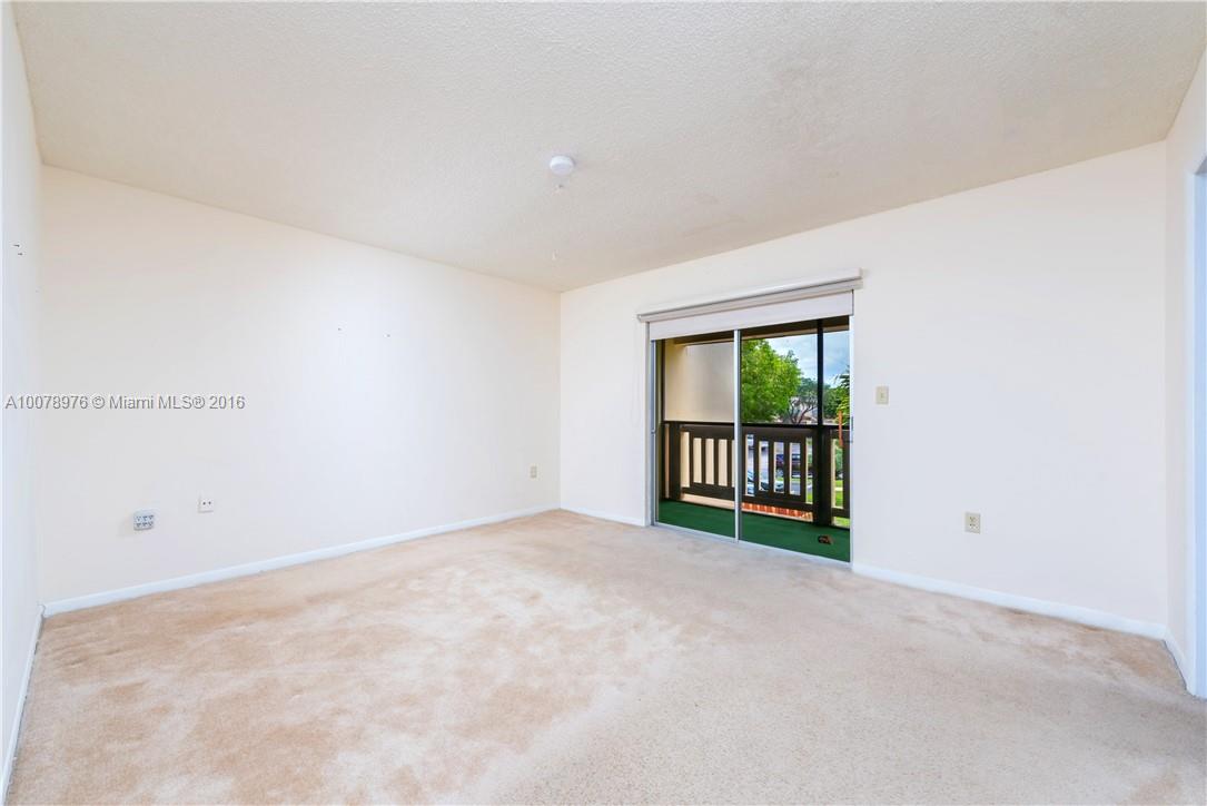 8375 Southwest 137th Avenue, Unit 8375 Miami, FL 33183 - Photo 21 of 30 a view of an empty room with a window