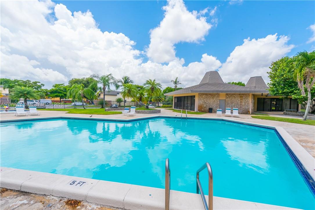 8375 Southwest 137th Avenue, Unit 8375 Miami, FL 33183 - Photo 29 of 30 swimming pool with outdoor seating
