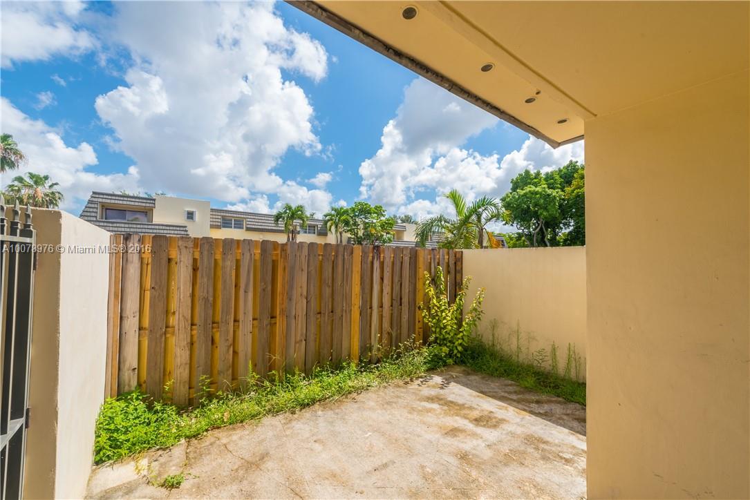 8375 Southwest 137th Avenue, Unit 8375 Miami, FL 33183 - Photo 5 of 30 a view of a backyard with pathway