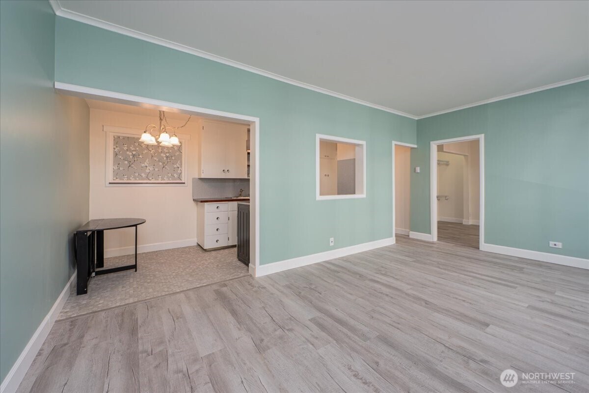 7 Harrison Street, Unit 20 Seattle, WA 98109 - Photo 4 of 27 a view of empty room with wooden floor and fan