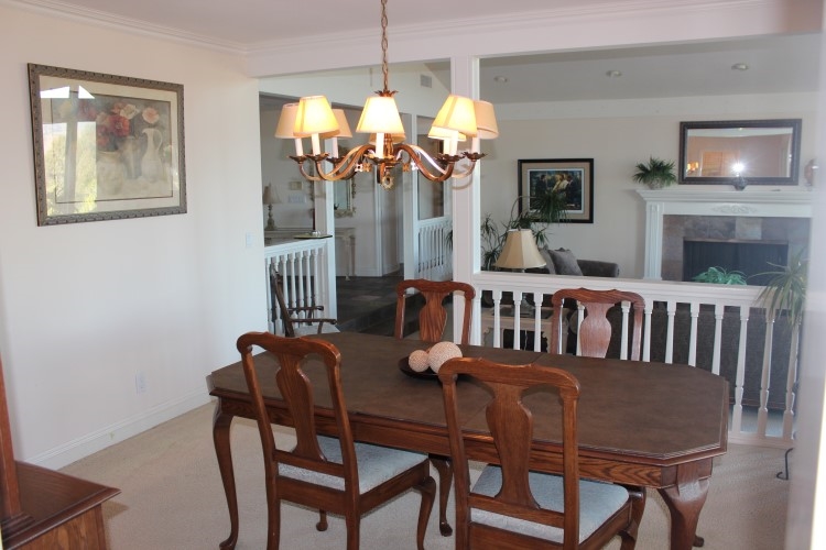 1624 Quail Ridge Road Escondido, CA 92027 - Photo 9 of 25 Large separate dining room situated above the living room and open to it with attractive dividing railing!