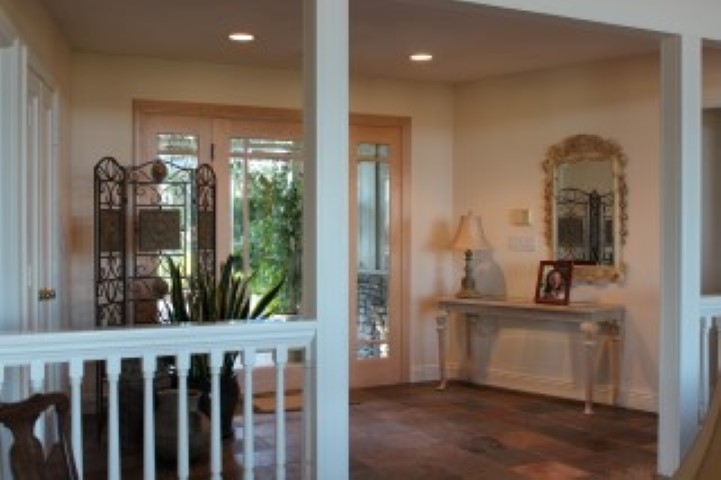 1624 Quail Ridge Road Escondido, CA 92027 - Photo 10 of 25 Large formal entry with custom wood and glass doors, slate flooring and custom wood railings separating it from the sunken living room.