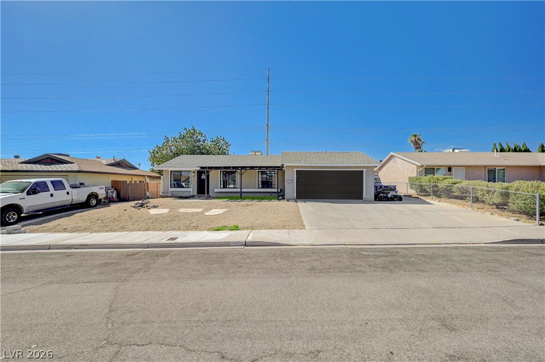1331 Pinto Road Boulder City, NV 89005 - Photo 44 of 46 A classic ranch-style residence featuring an attached garage and a concrete driveway.