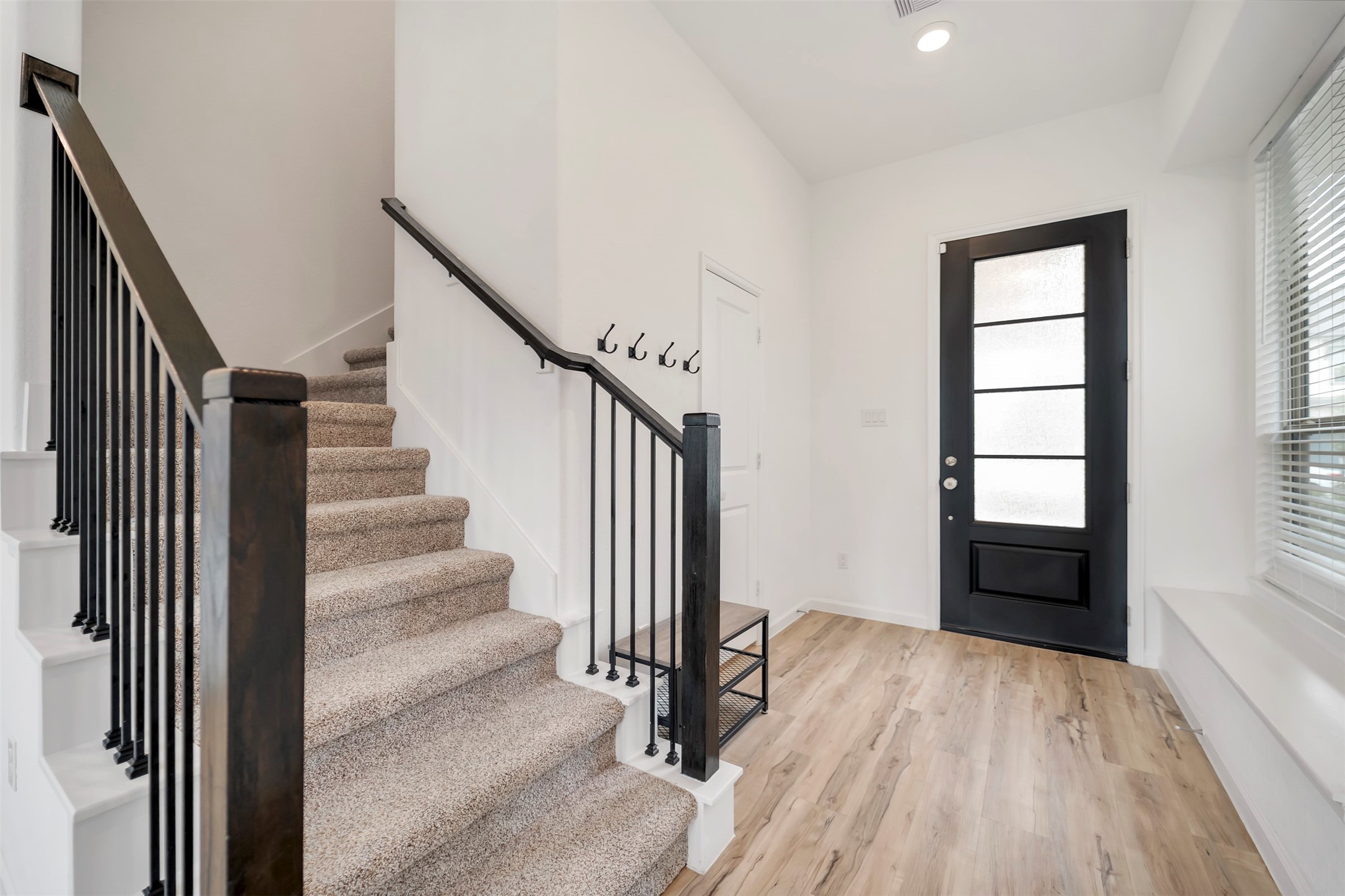 4127 Champlain Way Iowa Colony, TX 77583 - Photo 29 of 35 a view of a hallway with wooden floor and staircase
