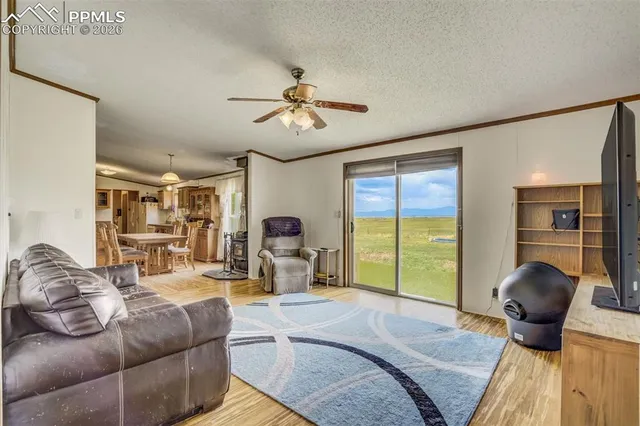 a bedroom with a bed and wall painting