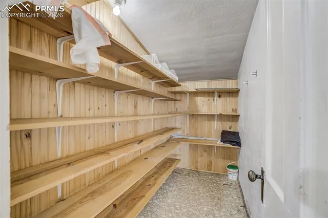 a view of a kitchen with furniture and a kitchen view