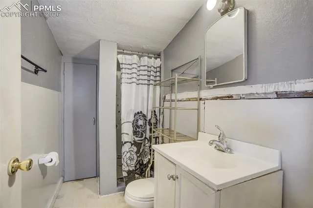 a view of kitchen with a refrigerator cabinets and wooden floor