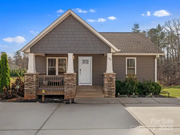 a front view of a house with garage