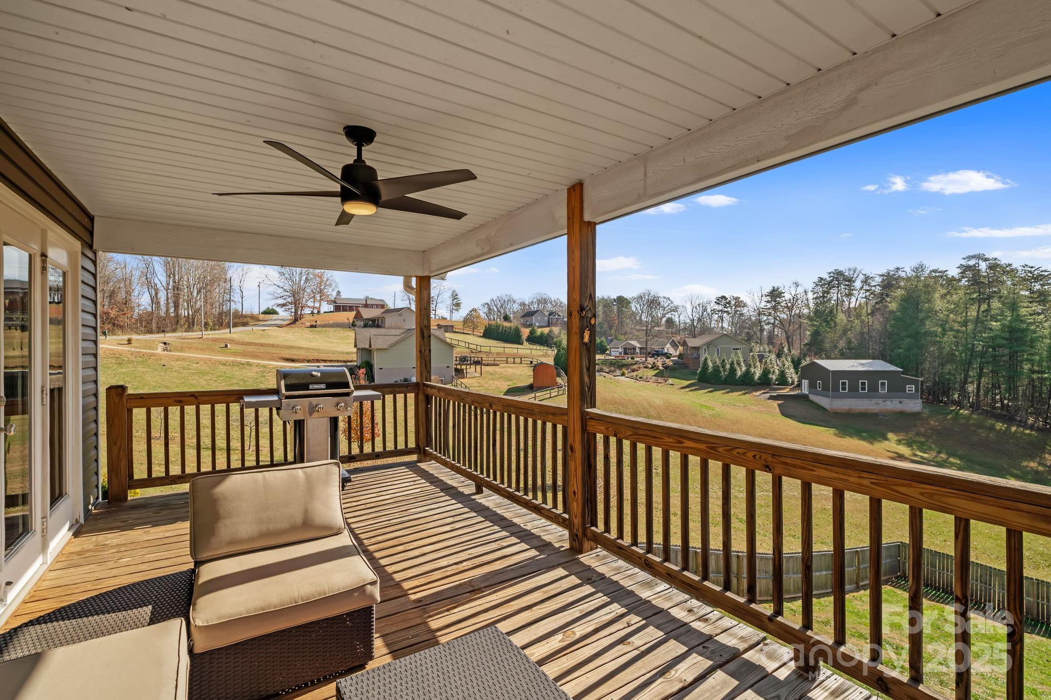 39 Curtis Miles Road Alexander, NC 28701 - Photo 16 of 37 a view of a balcony with furniture