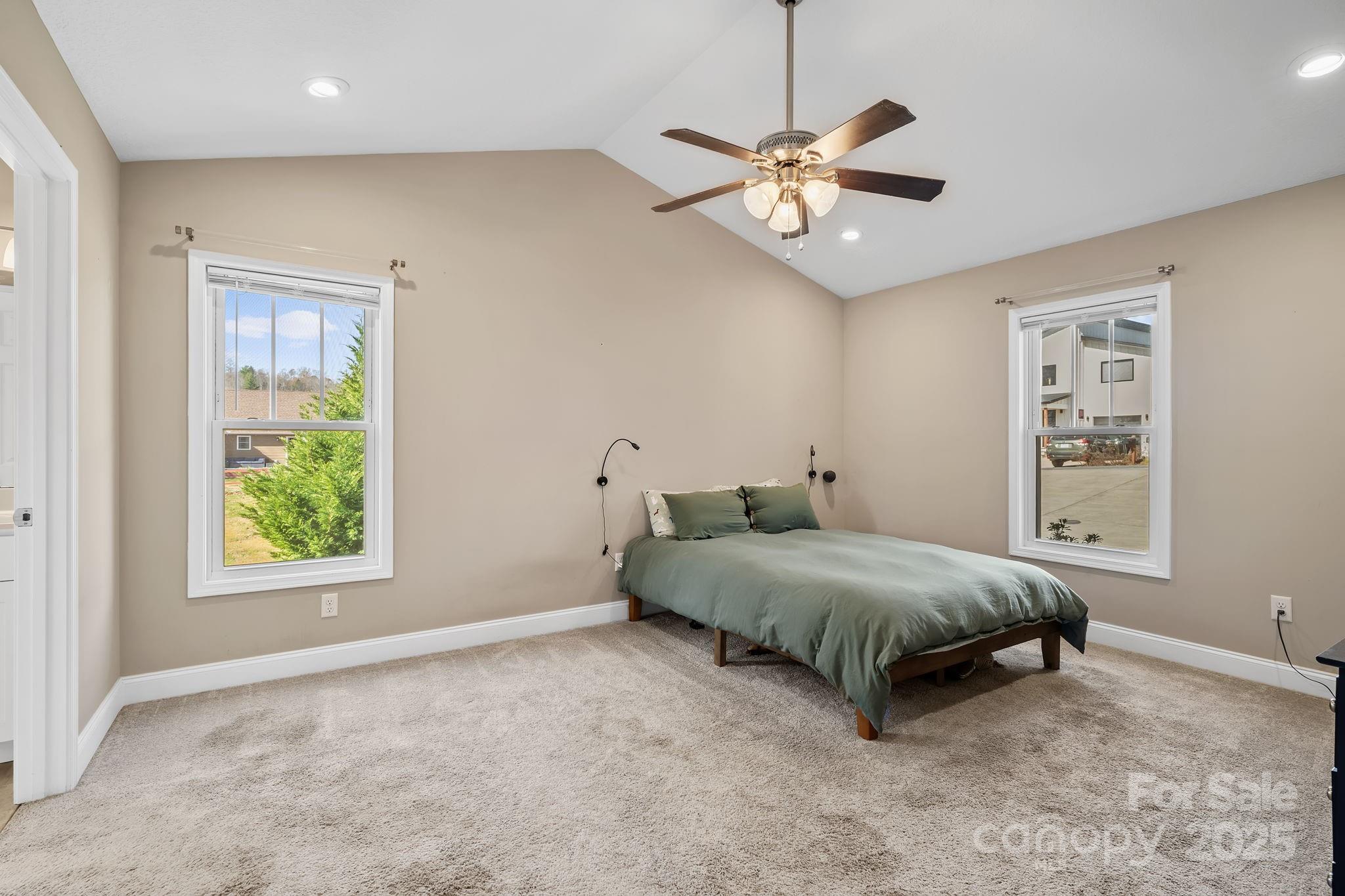 39 Curtis Miles Road Alexander, NC 28701 - Photo 18 of 37 a spacious bedroom with a bed and a window