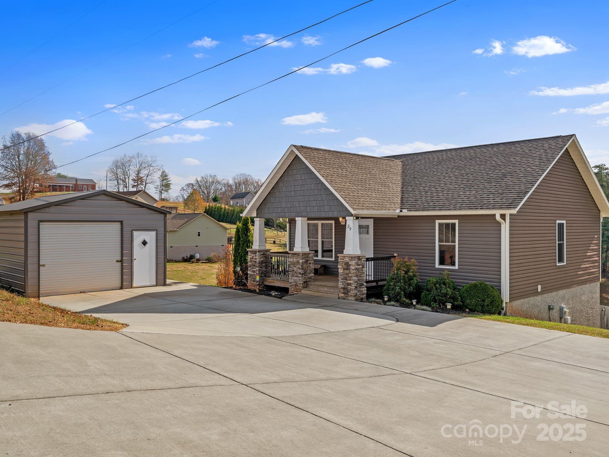 39 Curtis Miles Road Alexander, NC 28701 - Photo 2 of 37 a view of a house with large space and a car parked beside it