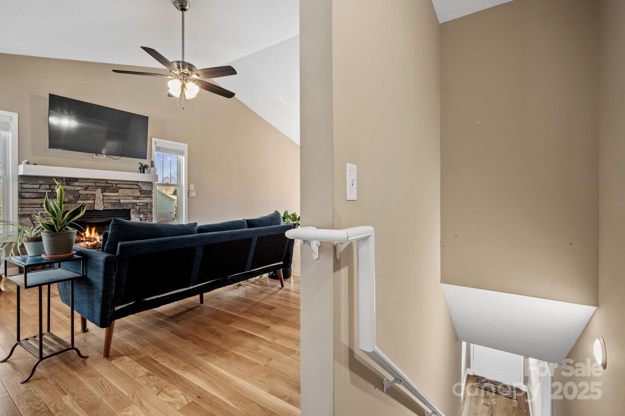 39 Curtis Miles Road Alexander, NC 28701 - Photo 22 of 37 a living room with furniture and a flat screen tv