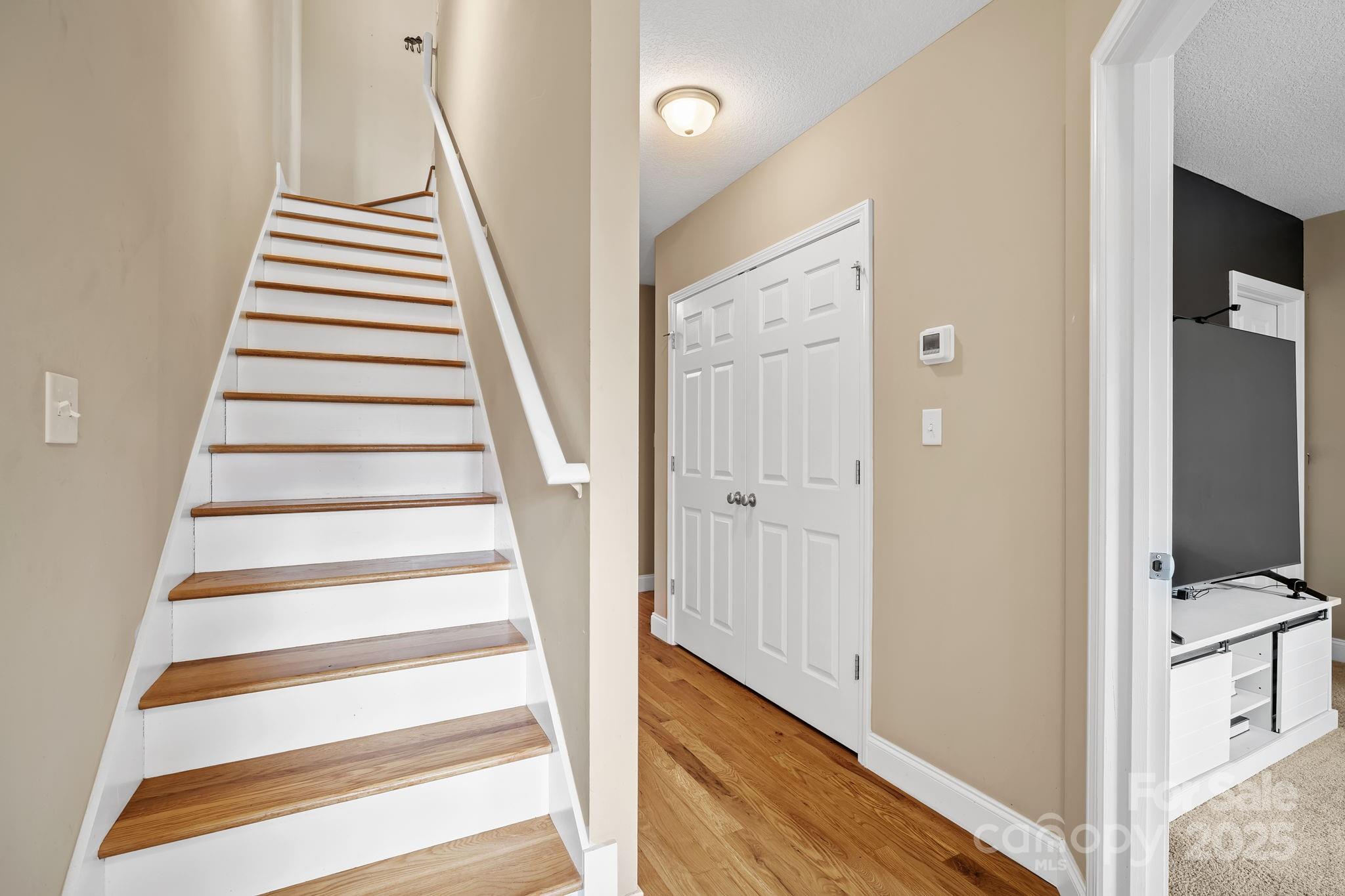 39 Curtis Miles Road Alexander, NC 28701 - Photo 23 of 37 a view of a hallway with wooden floor and entryway