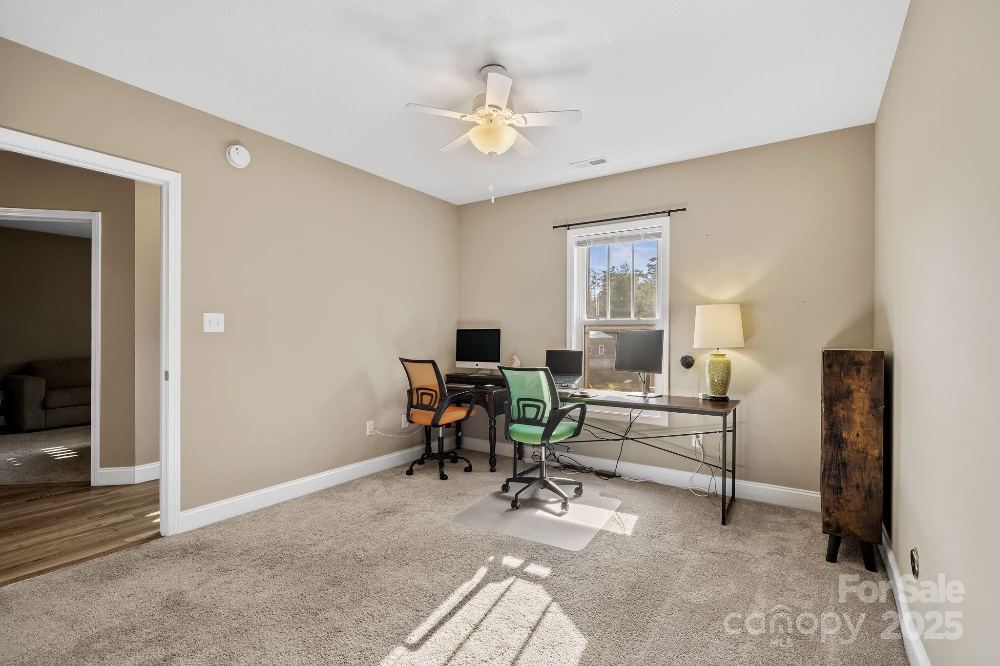 39 Curtis Miles Road Alexander, NC 28701 - Photo 26 of 37 a view of a livingroom with workspace and a window