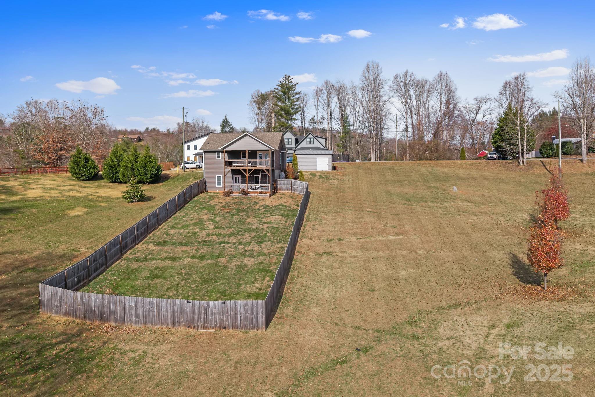 39 Curtis Miles Road Alexander, NC 28701 - Photo 34 of 37 a view of a swimming pool with outdoor seating and a terrace