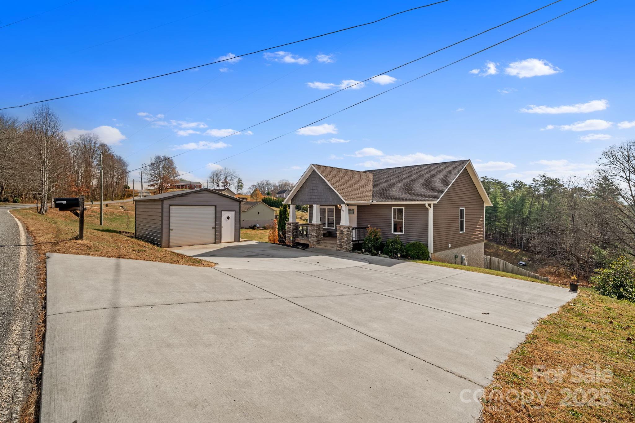 39 Curtis Miles Road Alexander, NC 28701 - Photo 37 of 37 a front view of a house with a yard
