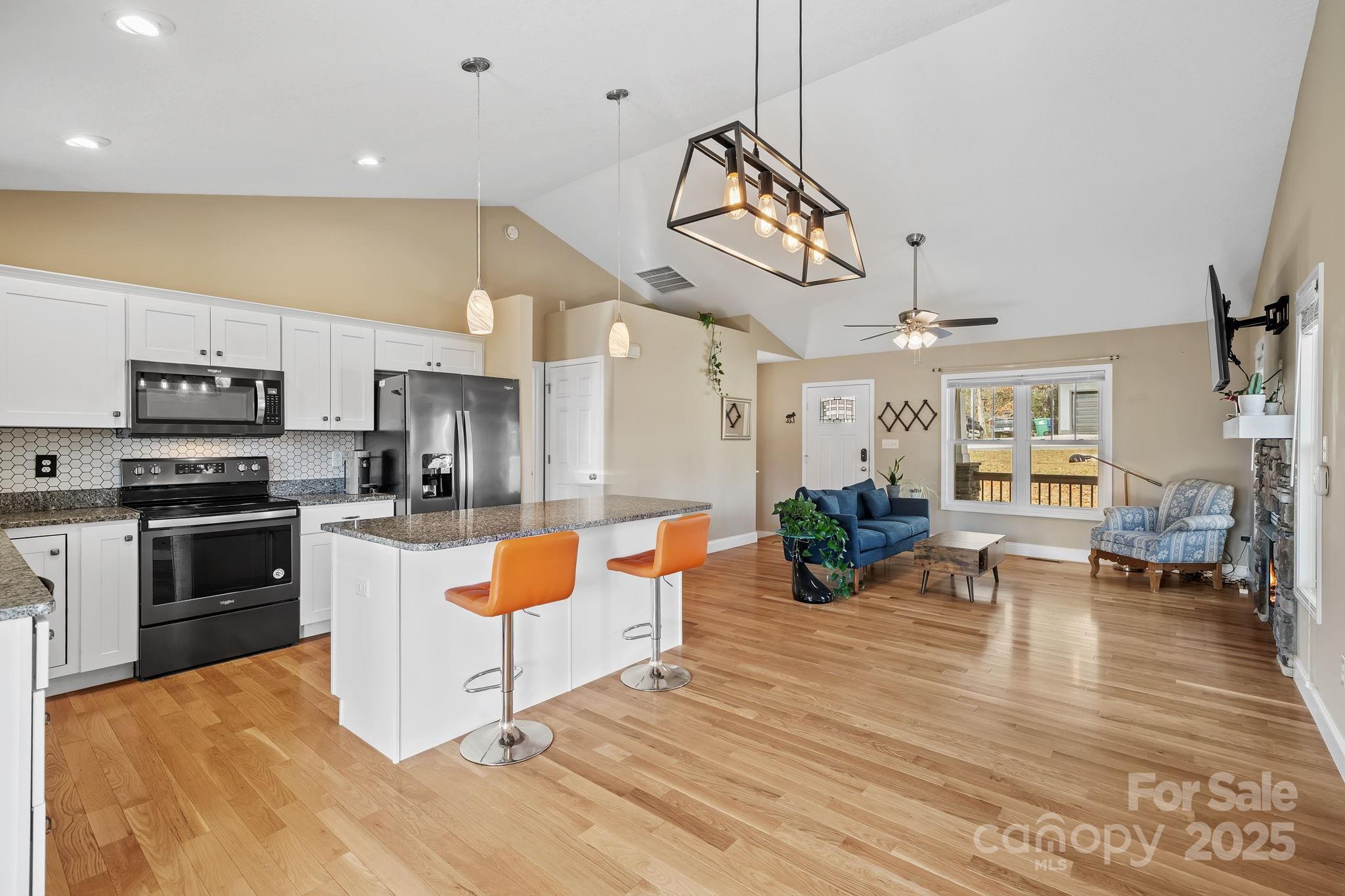 39 Curtis Miles Road Alexander, NC 28701 - Photo 5 of 37 a view of a kitchen with dining room wooden floor electronic appliances and wooden floor