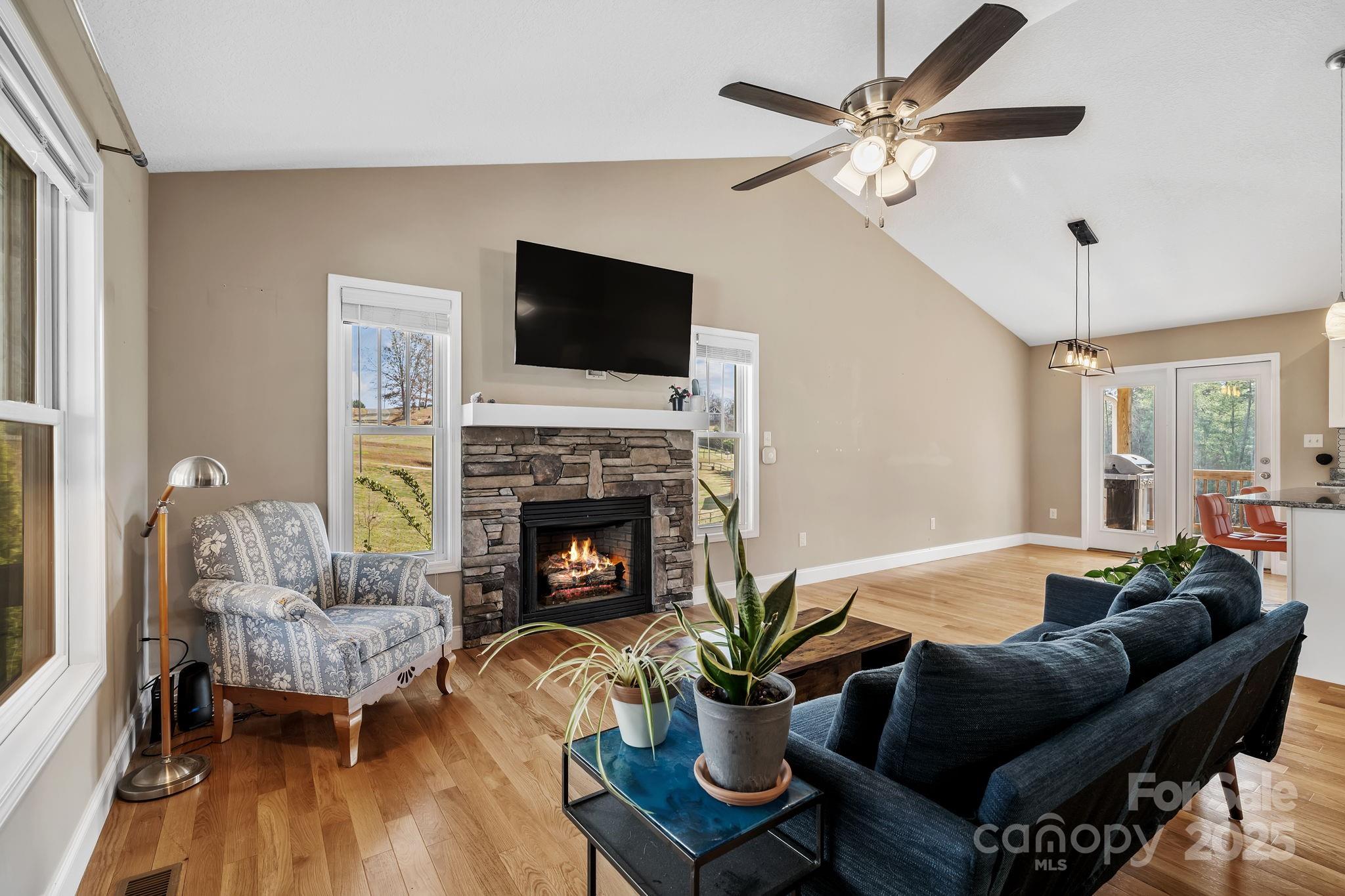 39 Curtis Miles Road Alexander, NC 28701 - Photo 8 of 37 a living room with furniture fireplace and a flat screen tv