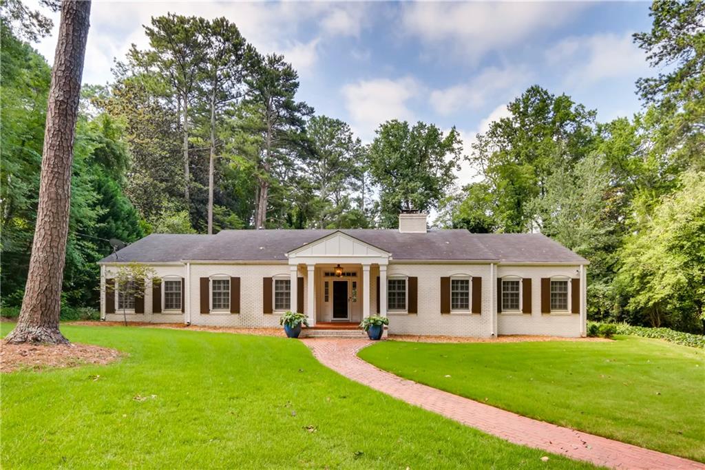 2370 Young Drive College Park, GA 30337 - Photo 1 of 1 a front view of a house with a garden and porch