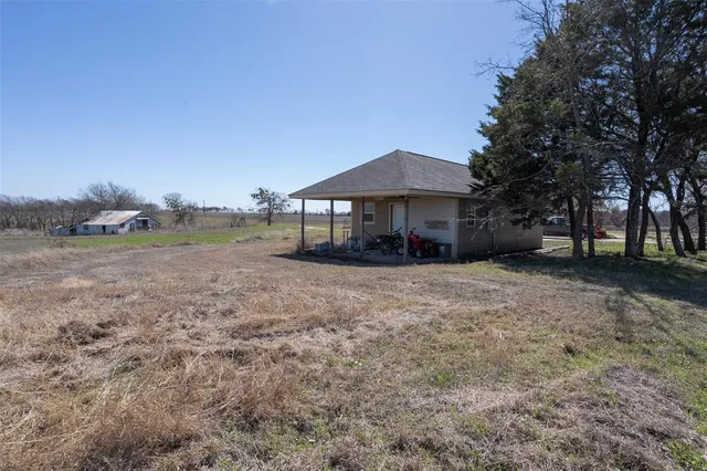 a house with trees in the background