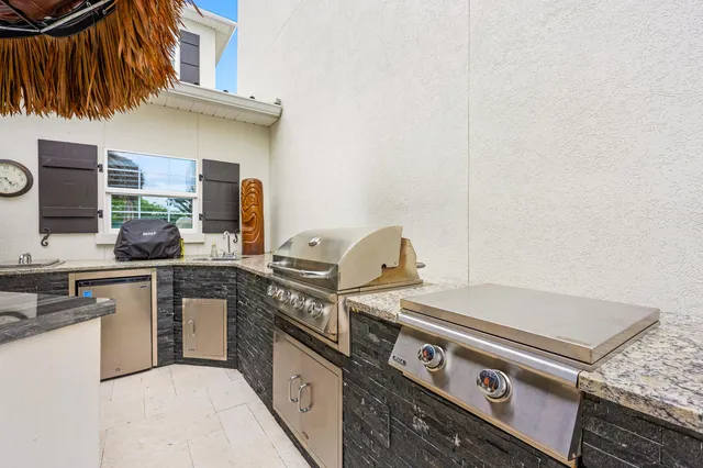 a living room with a fireplace and a flat screen tv