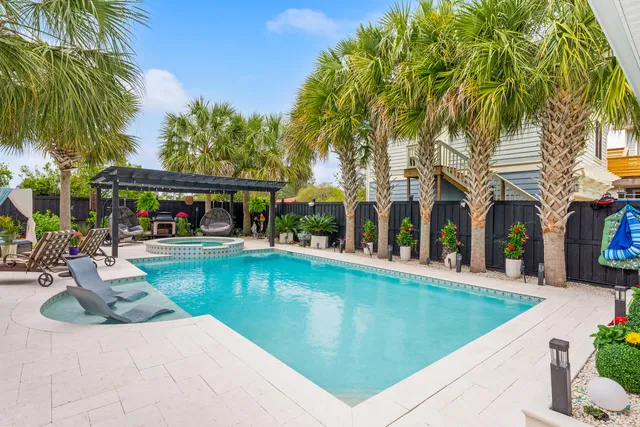 a bathroom with a granite countertop sink and a bathtub