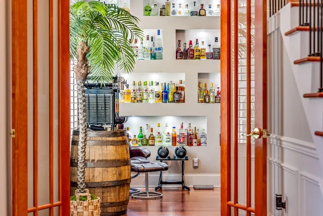 a view of a dining room with furniture and a window