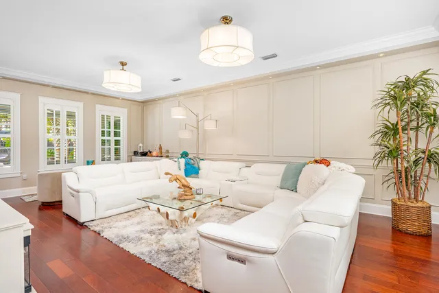 a patio with a table and chairs and a barbeque