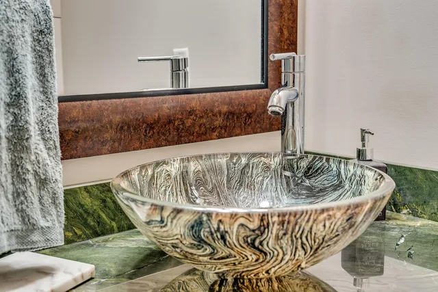 a view of a chairs and table in th patio