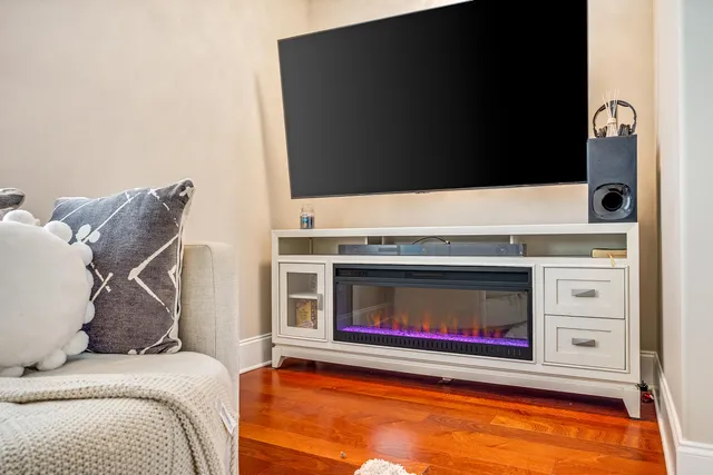 a kitchen with stainless steel appliances granite countertop a stove refrigerator and a wooden cabinets
