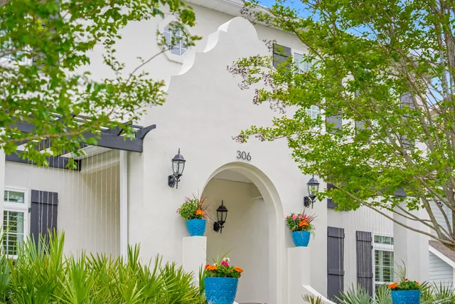a view of a house with swimming pool and a porch