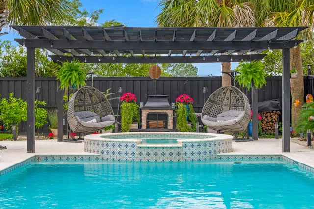 a view of living room filled with furniture and a garden
